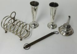 A silver plated six division toast rack, pair of spill vases and silver plated wine funnel (4).