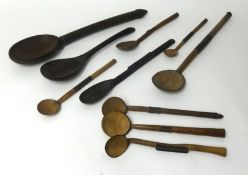 A collection of 10 Zulu wooden spoons in various shapes and sizes.