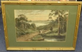A pair of prints after Greston of country landscapes in gilt frames, overall size 58cm x 83cm.
