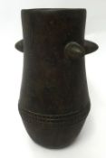 A Zulu milk pail, height 39cm.
