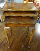 A nest of three walnut tables