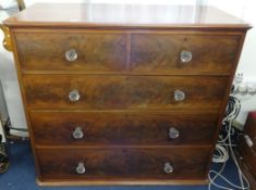 A Victorian mahogany chest of drawers, fitted with glass knobs, two short and three long drawers.
