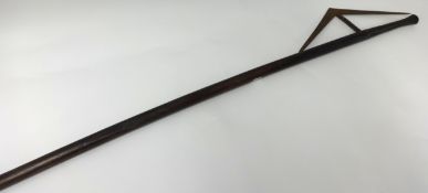 A Zulu Axe with angled and twist stem blade, length 115cm.