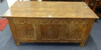An 18/19th century carved oak coffer.