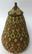 A grass grain storage vessel, height 49cm.