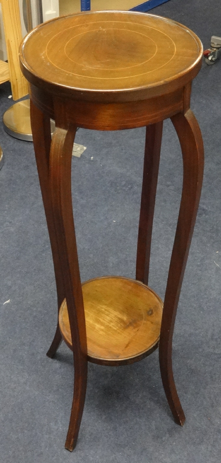 An Edwardian mahogany and inlaid two tier plant stand.