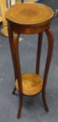 An Edwardian mahogany and inlaid two tier plant stand.