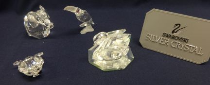 Swarovski Crystal Glass, collection of animals including swan on glass stand, toucan, small elephant