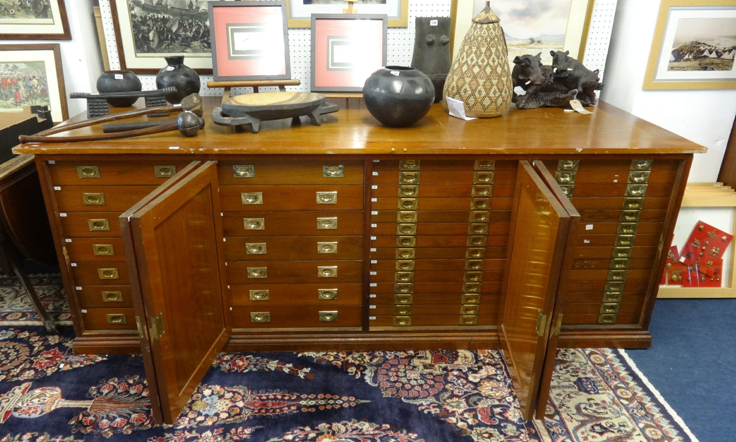 A large Museum Collectors Cabinet, comprising of four cupboard doors on each side, one side fitted