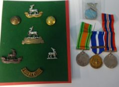 A collection of Military badges, buttons and epaulets of various Regiments also a UN medal.