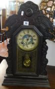 A Victorian wood case clock, Ansonia, USA., height 58cm.`