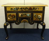A reproduction Chinese lacquered lowboy, the top decorated with Peacocks gilt work and flowers,