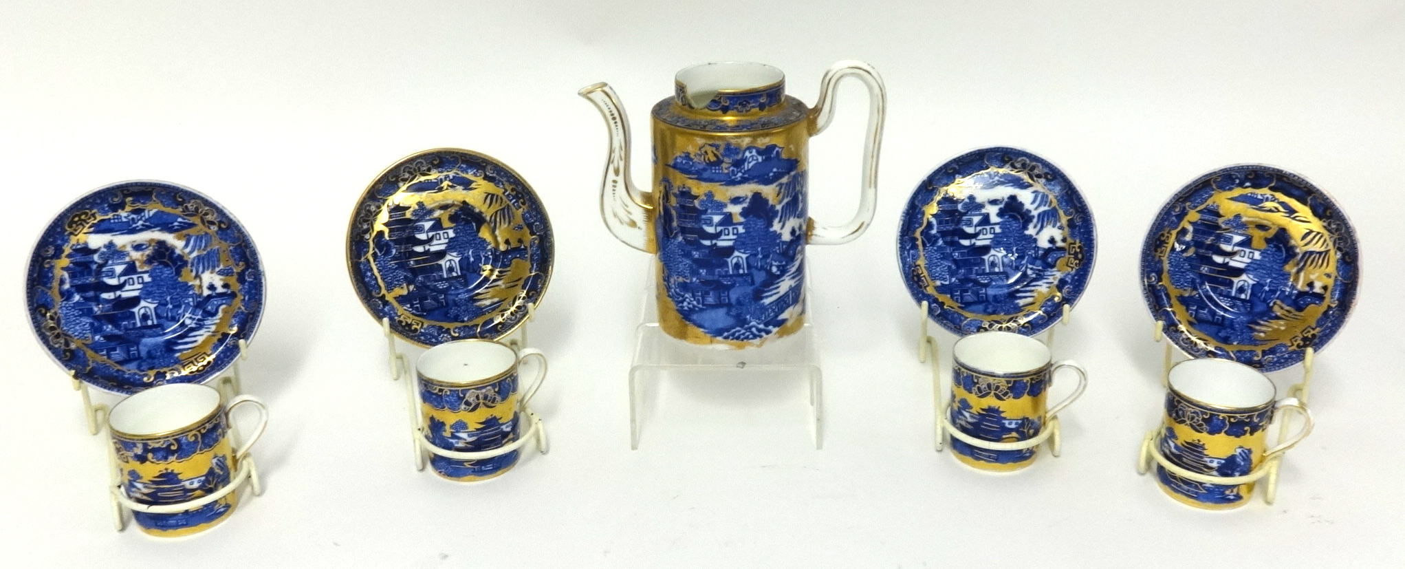 A Coalport blue willow and gilt pattern coffee set (four coffee cans & saucers and a coffee pot (