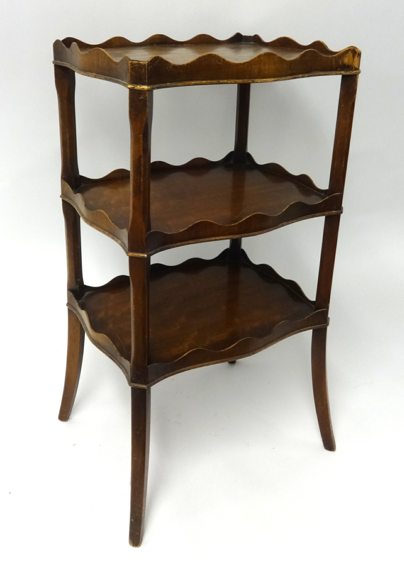 A small mahogany three tier Étagère.