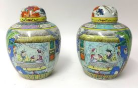 Pair of Chinese ginger jars with covers brightly decorated with figures and plants etc, height