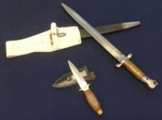 A Wilkinson bayonet and scabbard, also a small dagger and sheaf, with Sheffield blade (2).