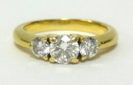 A 18ct three stone diamond set ring, the centre stone approx 0.30cts, finger size L.