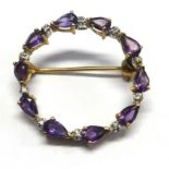 A 9ct amethyst set brooch stamped, .375.