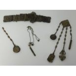 A Victorian chatelaine, with scent bottle propelling pencil, notebook, needle case, mirror and an