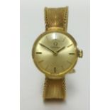 Omega, a ladies 9ct gold wristwatch, with baton numerals and Milanese bracelet, total weight 23gms.