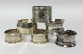 Four various silver napkin rings approx 3.48ozs, also a pair of silver plated napkin rings (6).
