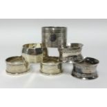 Four various silver napkin rings approx 3.48ozs, also a pair of silver plated napkin rings (6).