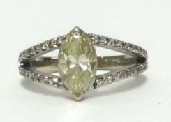 A fine 18ct diamond fancy yellow cluster ring, the centre marquis cut diamond approx 1.03cts,