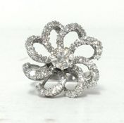 A fine diamond set 'swirl' ring each branch set with diamonds, the central stone approx 1ct, set