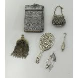 Various chatelaine items including silver purse pendant, silver miniature child's bag and coins,
