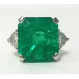 An impressive Colombian emerald and diamond set ring, the square emerald weight approx 17cts, finger