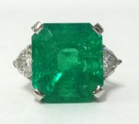 An impressive Colombian emerald and diamond set ring, the square emerald weight approx 17cts, finger