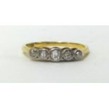 An 18ct yellow gold and platinum five stone diamond ring, finger size O.