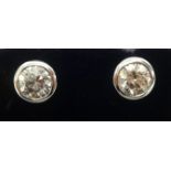 A fine pair of diamond stud earrings, the round cut diamonds approx 2cts combined weight.