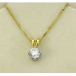 A diamond single stone pendant necklace set in white gold on an 18ct mount with fine chain, the