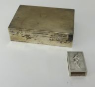 A silver cigarette box of rectangular form, maker W.N and S.T, with inscription dated 1951 also a