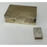 A silver cigarette box of rectangular form, maker W.N and S.T, with inscription dated 1951 also a