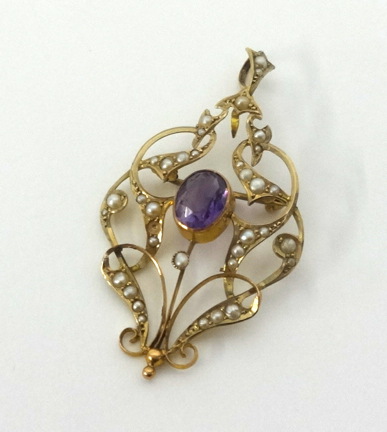 An antique 9ct gold amethyst and seed pearl pendant of Art Nouveau design approx 4.1gms.