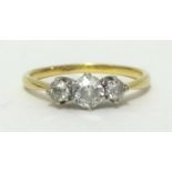 A 18ct diamond three stone ring, finger size S.