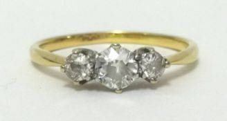 A 18ct diamond three stone ring, finger size S.