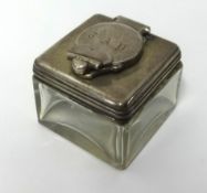 A 19th Century silver and glass inkwell of square form, approx 40mm wide.