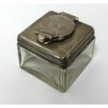 A 19th Century silver and glass inkwell of square form, approx 40mm wide.