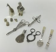 Objects, including grape scissors, novelty pepperette in the form of a Dutch boy, asparagus clips,