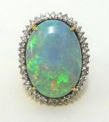 An impressive 18ct gold large opal and diamond cluster ring, approx 28mm x 20mm, finger size O.