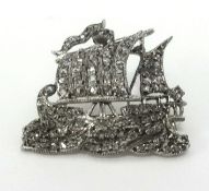 An antique diamond set galleon brooch, boxed.