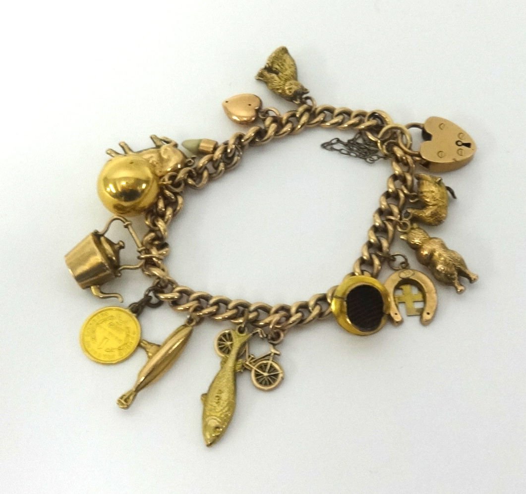 A 9ct gold charm bracelet approx 21gms.