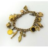 A 9ct gold charm bracelet approx 21gms.