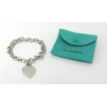 Tiffany, a silver bracelet with heart pendant and bar, approx 76gms with box.