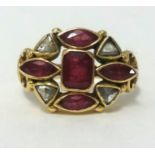 A 14k ruby and diamond ring, finger size K/L.