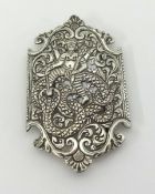 A ornate Indian white metal silver? belt buckle, approx 95mm x 50mm.