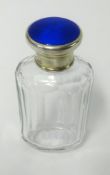 A silver topped scent bottle with blue enamel, height 9cm.